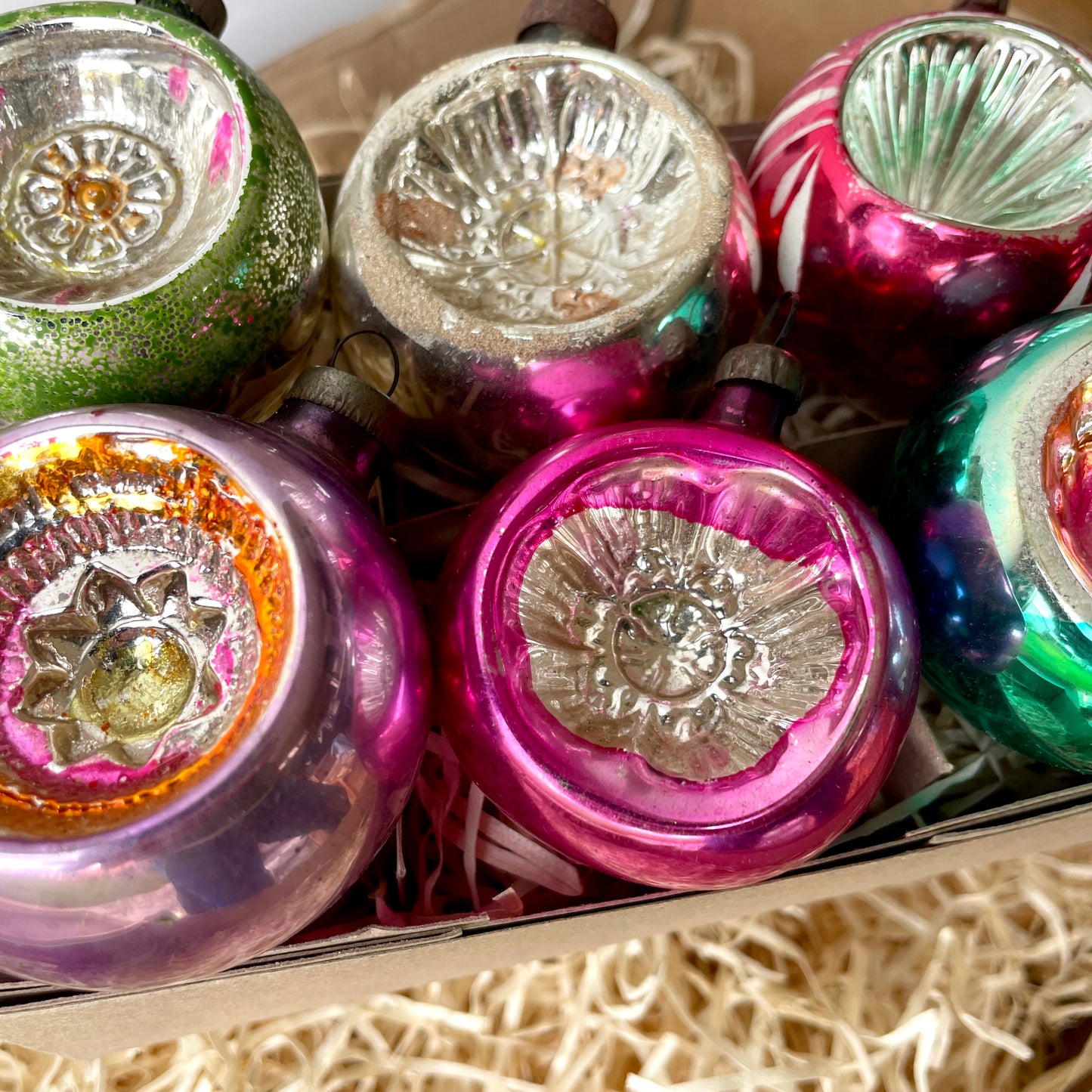 Six early concaved glass baubles