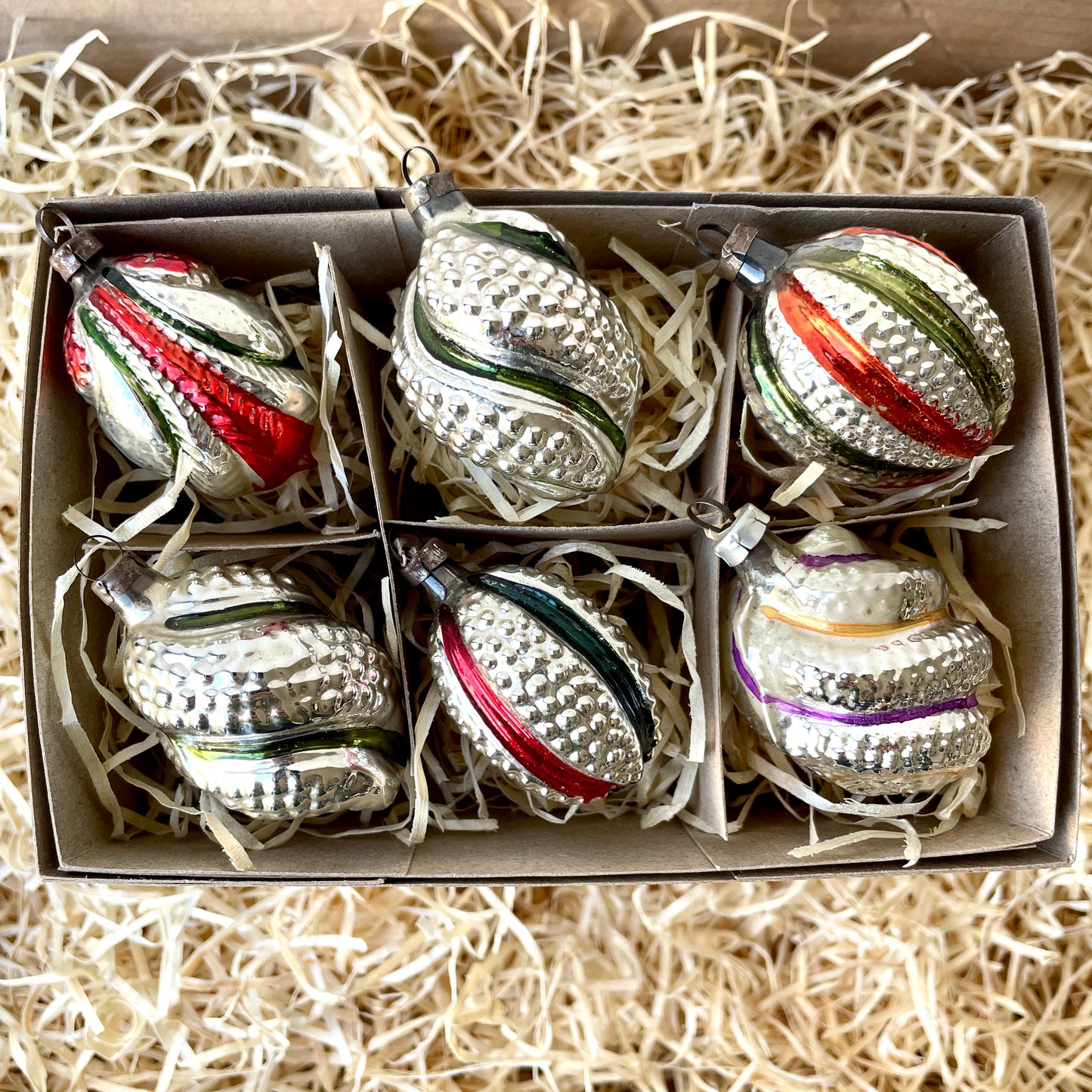 Six vintage twist and stipple shaped glass baubles