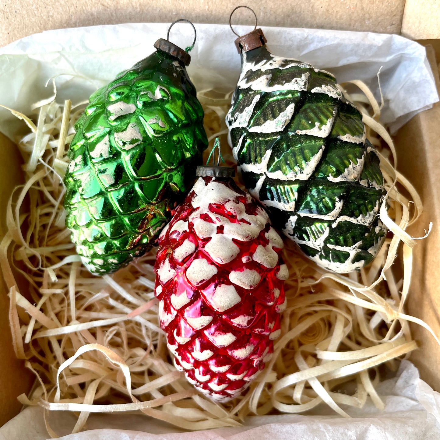 Three vintage pine cones shaped glass baubles