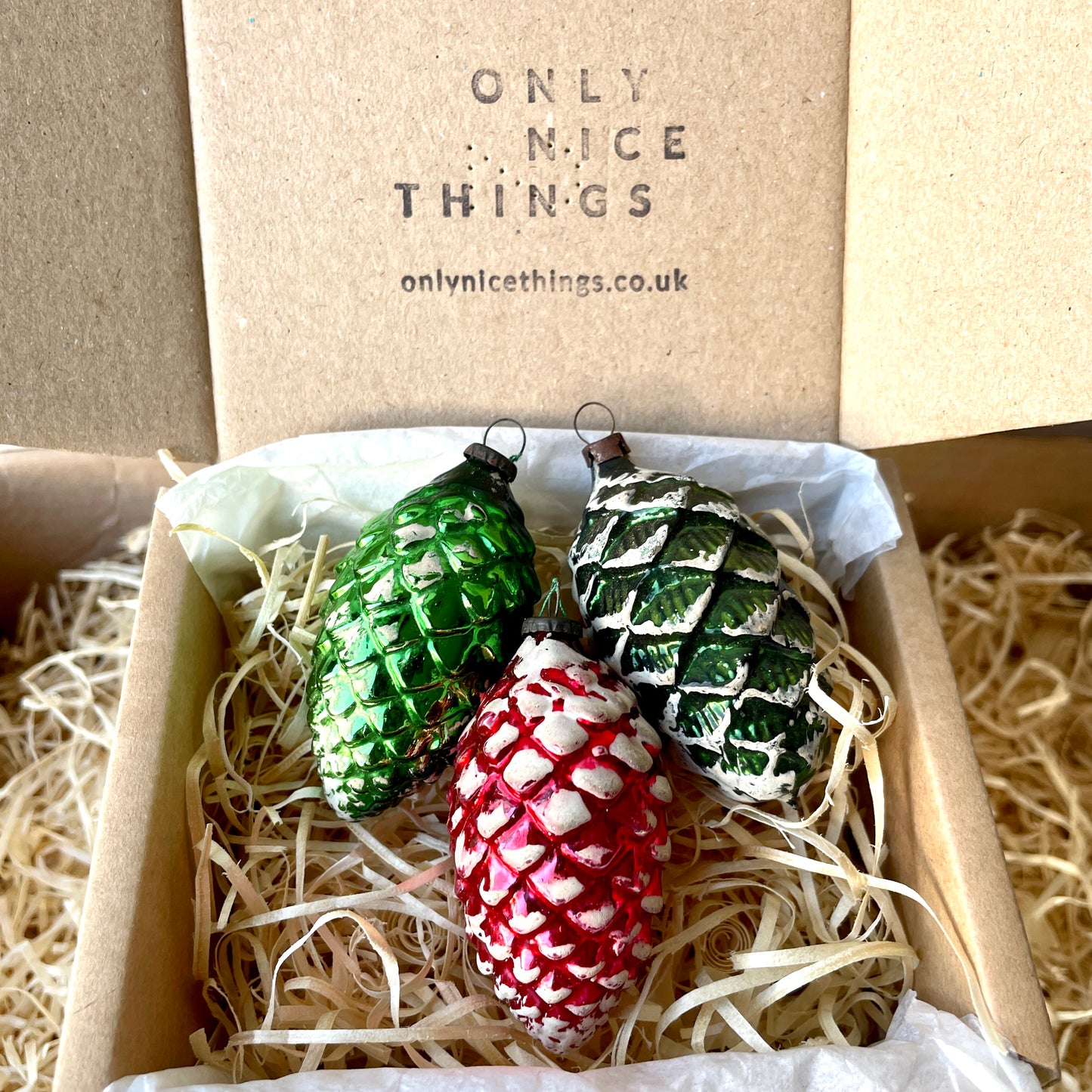 Three vintage pine cones shaped glass baubles