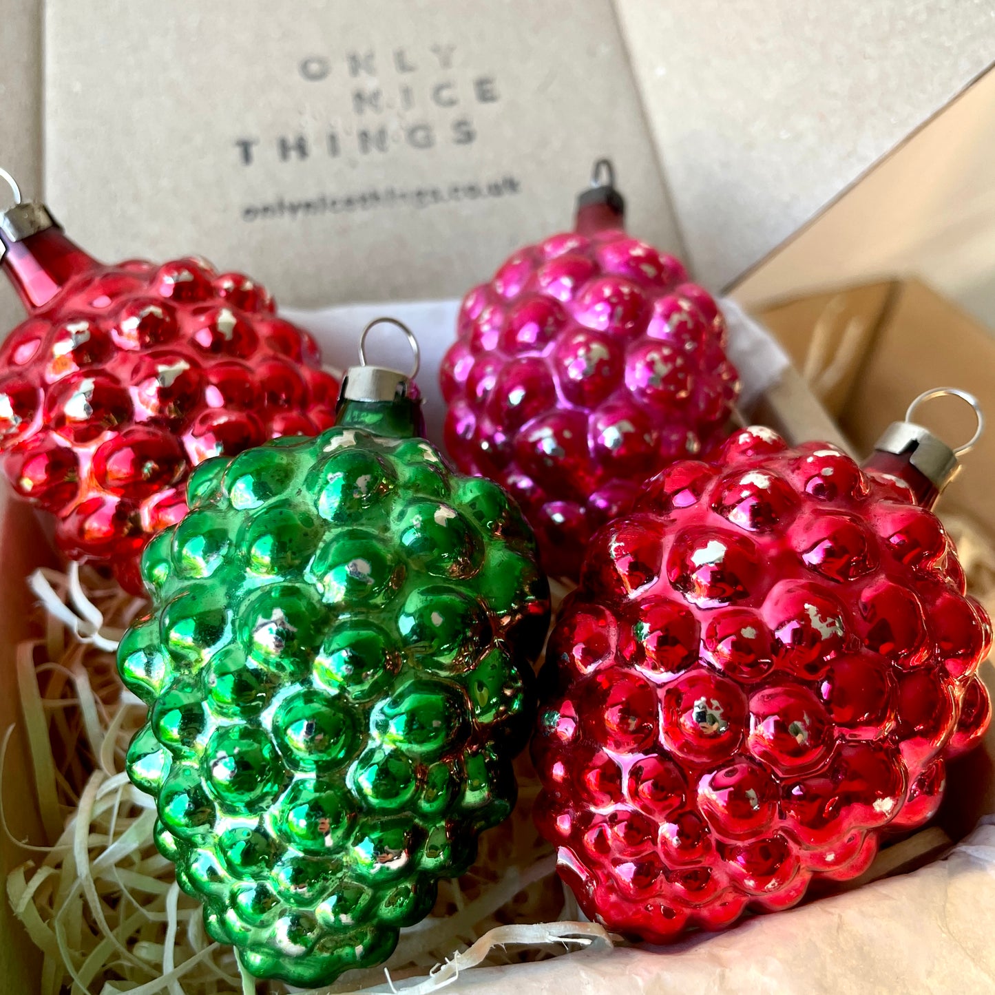 Four early berry shaped baubles