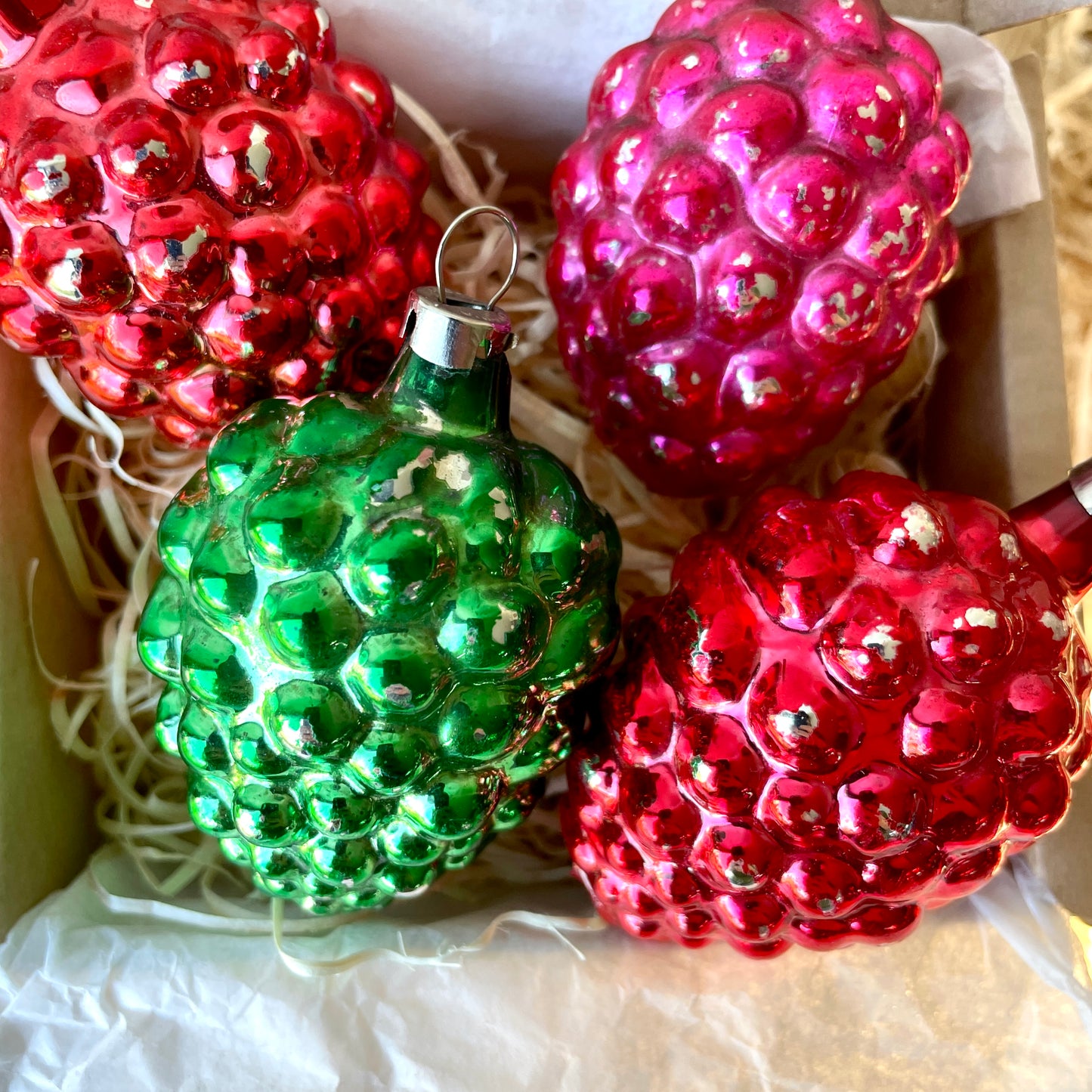 Four early berry shaped baubles