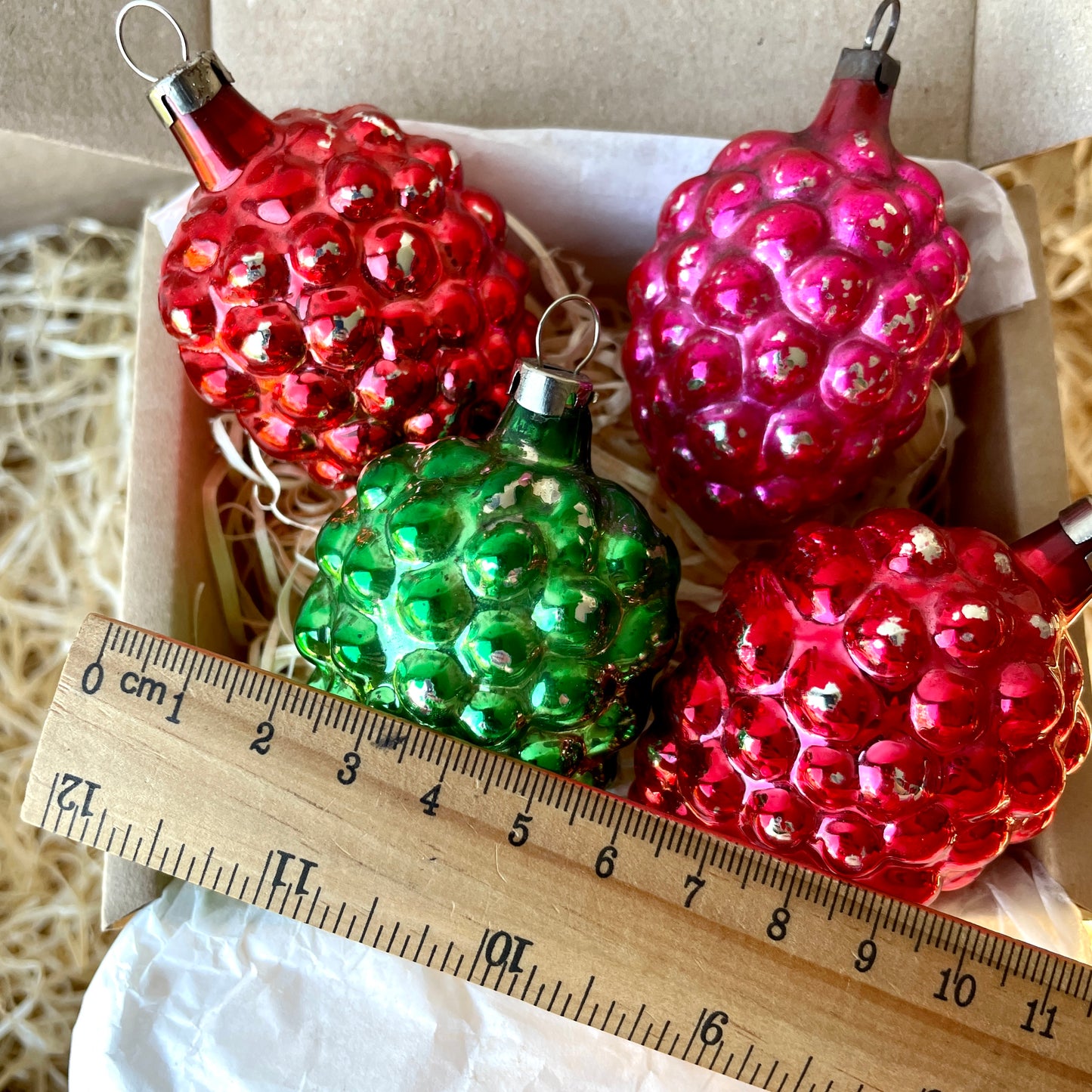 Four early berry shaped baubles