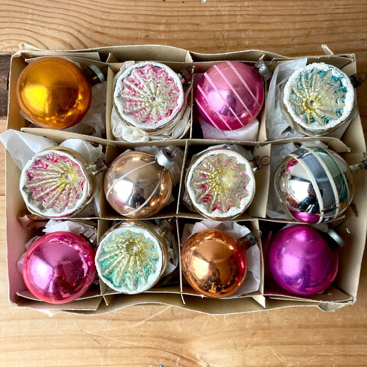 Twelve pastel baubles